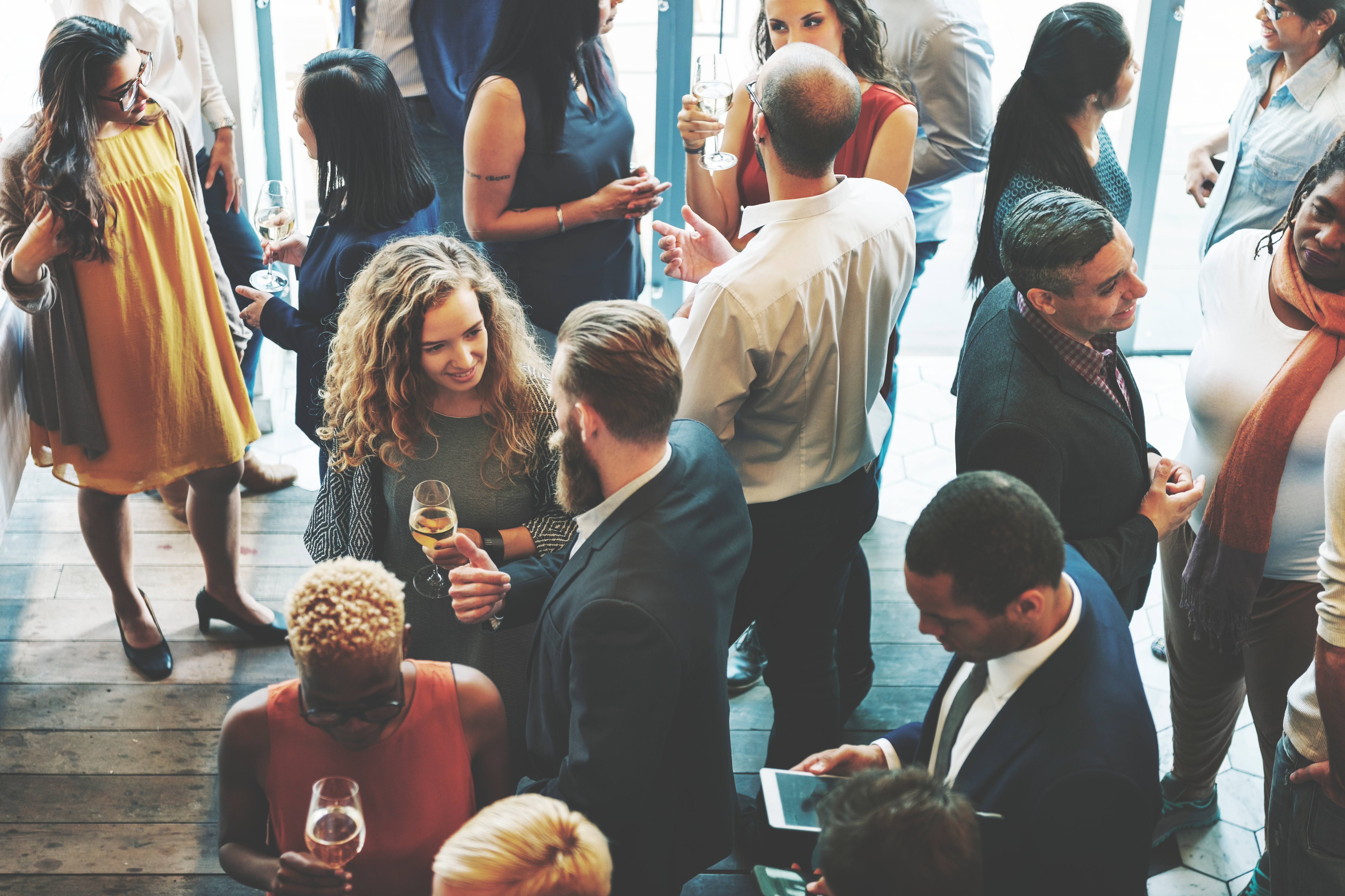 Professionals networking at an event